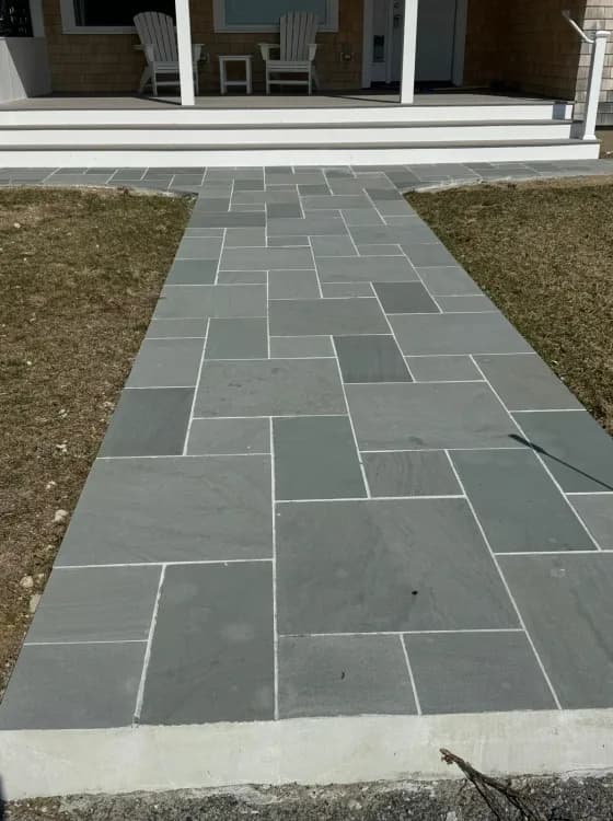 Elegant hardscape pathway that creates a welcoming first impression.